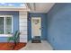 Inviting front entryway showcases a vibrant exterior paint and a decorative welcome mat at 6471 109Th N Ter, Pinellas Park, FL 33782