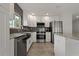 Modern kitchen with granite countertops and stainless steel appliances at 6471 109Th N Ter, Pinellas Park, FL 33782