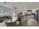 Open-concept living room with stylish furnishings, seamlessly connecting to the kitchen and dining area at 6471 109Th N Ter, Pinellas Park, FL 33782