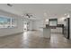 Bright and airy living room featuring tile flooring and a seamless flow into the kitchen area at 6471 109Th N Ter, Pinellas Park, FL 33782