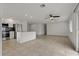 Open-concept living space featuring tile flooring and seamless transition to the kitchen area at 6471 109Th N Ter, Pinellas Park, FL 33782