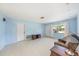 Comfortable living room with tile flooring, neutral walls, and ample space at 6520 Meadowbrook Ln, New Port Richey, FL 34653