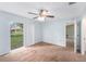 Cozy bedroom with carpet, and sliding glass doors leading to the backyard at 7318 Lamplighter St, Spring Hill, FL 34606