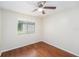 Bedroom with hardwood floors and a window with a view at 7318 Lamplighter St, Spring Hill, FL 34606