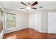Bedroom with hardwood floors and plenty of natural light at 7318 Lamplighter St, Spring Hill, FL 34606