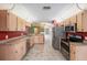 Well-lit kitchen with modern appliances, and ample counter space at 7318 Lamplighter St, Spring Hill, FL 34606