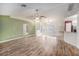 Bright living area with hardwood floors, and a large window at 7318 Lamplighter St, Spring Hill, FL 34606