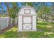 Charming storage shed in the backyard provides extra space for gardening tools and equipment at 7318 Lamplighter St, Spring Hill, FL 34606
