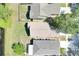 Aerial view of the neighborhood featuring manicured lawns, mature trees, and serene lake views, creating a peaceful community at 7855 Bristol Park Dr., Apollo Beach, FL 33572