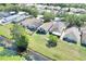 Aerial view of homes in the neighborhood with ponds showing the well-manicured landscaping and proximity to nature at 7855 Bristol Park Dr., Apollo Beach, FL 33572