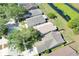 Aerial view of homes near a pond showcasing the well-maintained landscaping and peaceful surroundings at 7855 Bristol Park Dr., Apollo Beach, FL 33572