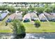 An aerial view displaying neighborhood homes near a waterway, emphasizing the community's serene environment at 7855 Bristol Park Dr., Apollo Beach, FL 33572