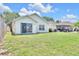 Backyard with a view of the home, patio, and an outdoor grill at 7855 Bristol Park Dr., Apollo Beach, FL 33572