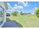 Backyard with lawn to the water featuring homes in the distance at 7855 Bristol Park Dr., Apollo Beach, FL 33572