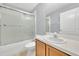 Bathroom featuring a shower with glass door, tile flooring, and sink at 7855 Bristol Park Dr., Apollo Beach, FL 33572