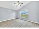 Bedroom featuring a ceiling fan and a view out the window at 7855 Bristol Park Dr., Apollo Beach, FL 33572
