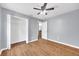 Bedroom with light grey walls and closet with hardwood flooring at 7855 Bristol Park Dr., Apollo Beach, FL 33572
