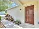 Exterior of a home with a well-manicured walkway leading to the front door at 7855 Bristol Park Dr., Apollo Beach, FL 33572