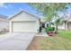 Charming single-story home with a two-car garage and well-maintained landscaping at 7855 Bristol Park Dr., Apollo Beach, FL 33572