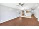Spacious living room with wood flooring and an open view of the kitchen at 7855 Bristol Park Dr., Apollo Beach, FL 33572
