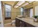 Bathroom featuring natural stone countertops, a vessel sink, and tiled floors at 800 Belted Kingfisher S Dr, Palm Harbor, FL 34683