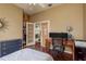 Bedroom showcasing hardwood floors, closet and natural light with space for a home office at 800 Belted Kingfisher S Dr, Palm Harbor, FL 34683
