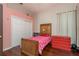 Charming bedroom featuring hardwood floors, a closet, and a cute decor at 800 Belted Kingfisher S Dr, Palm Harbor, FL 34683