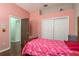 Bedroom featuring hardwood floors, a closet, and decorated with cartoon characters theme at 800 Belted Kingfisher S Dr, Palm Harbor, FL 34683