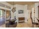 Dining area featuring a modern light fixture, picnic-style table, and access to an outdoor patio at 800 Belted Kingfisher S Dr, Palm Harbor, FL 34683