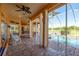 Screened-in lanai with views of the pool and a hammock with access to the lake at 800 Belted Kingfisher S Dr, Palm Harbor, FL 34683