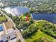 Lakeside home surrounded by lush landscaping, conveniently located near schools and a main road at 8011 N Mobley Rd, Odessa, FL 33556