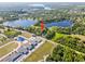 Lakefront home near local schools, featuring lush landscaping and easy access to community amenities at 8011 N Mobley Rd, Odessa, FL 33556