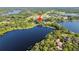 Beautiful lakefront property surrounded by lush trees, close to schools and recreation, perfect for lakeside living at 8011 N Mobley Rd, Odessa, FL 33556