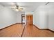 Bright bedroom with white walls, ceiling fan, closet, and natural light at 8011 N Mobley Rd, Odessa, FL 33556
