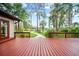 Expansive deck overlooking a beautifully landscaped yard and a serene pathway leading to the waterfront at 8011 N Mobley Rd, Odessa, FL 33556