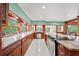 Bright kitchen with granite countertops, stainless steel appliances, and ample cabinet space at 8011 N Mobley Rd, Odessa, FL 33556