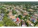 A high-angle view of residences in a community, with rooftops visible among trees at 8916 Southbay Dr, Tampa, FL 33615