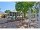 Beautiful backyard featuring a brick patio, garden, and screened-in porch, perfect for entertaining at 8916 Southbay Dr, Tampa, FL 33615