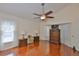 Spacious bedroom with ceiling fan, wood floors, and bright natural light at 8916 Southbay Dr, Tampa, FL 33615