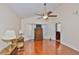 Spacious bedroom with ceiling fan, hardwood floors, and closet at 8916 Southbay Dr, Tampa, FL 33615