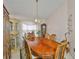 Elegant dining room featuring a large table, bright window, and classic furnishings at 8916 Southbay Dr, Tampa, FL 33615