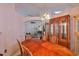 Elegant dining room with large wood table and view to the living room at 8916 Southbay Dr, Tampa, FL 33615