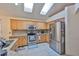 Bright kitchen with skylights, stainless appliances, and granite countertops at 8916 Southbay Dr, Tampa, FL 33615