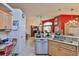 Open kitchen view showcases stainless steel appliances and granite countertops at 8916 Southbay Dr, Tampa, FL 33615