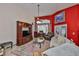 Bright living room with vaulted ceilings, a ceiling fan, a TV stand, and comfortable seating at 8916 Southbay Dr, Tampa, FL 33615
