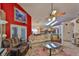 Inviting living room featuring a comfortable sofa, ceiling fan, and bright skylights at 8916 Southbay Dr, Tampa, FL 33615