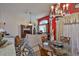 Comfortable living space with a crystal chandelier, connecting to dining area at 8916 Southbay Dr, Tampa, FL 33615