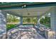Covered picnic area with multiple tables and benches, offering a shady spot for outdoor gatherings at 8916 Southbay Dr, Tampa, FL 33615