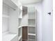 Walk-in closet with custom shelving and storage solutions for optimal organization at 10006 N Connechusett Rd, Tampa, FL 33617