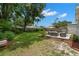 Lush backyard with a manicured lawn and an outdoor seating area perfect for entertaining at 1003 W Indiana Ave, Tampa, FL 33603